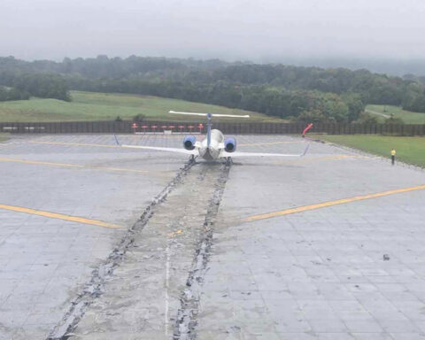 First officer twice tried to stop botched landing before plane skidded off the end of the runway, NTSB says