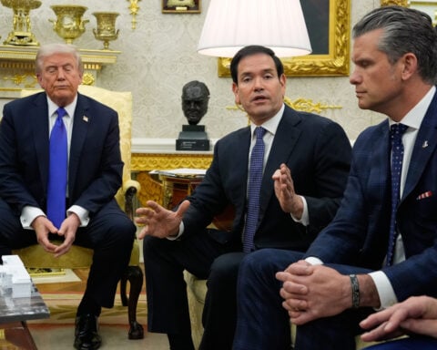 The Latest: Trump pardons Binance founder Changpeng Zhao