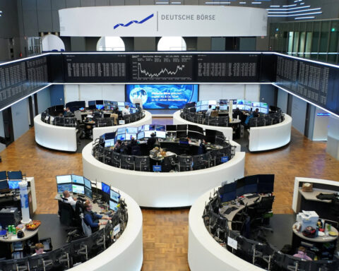 European shares close at record high on US data, trade hopes