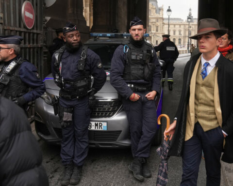 Inspector Clouseau? The mystery man in an AP photo after the Louvre jewel heist creates a buzz