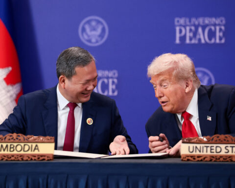 Trump oversees truce signing and trade deal flurry on first Asian stop