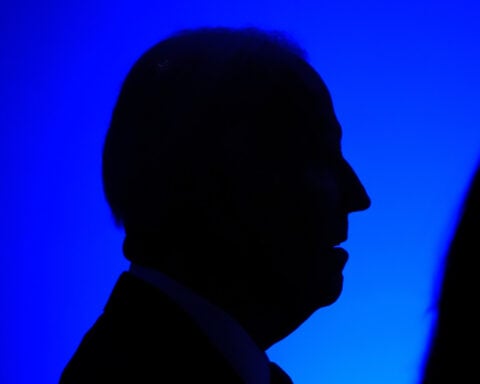 Biden warns of dark days for the country as he urges Americans to stay optimistic