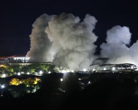 Stragglers from Myanmar scam center raided by army cross into Thailand as buildings are blown up