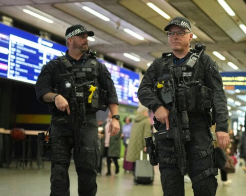 UK police charge man with attempted murder over train stabbing that wounded 11 people