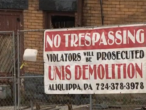 Man found dead inside partially collapsed building 1 day after massive fire