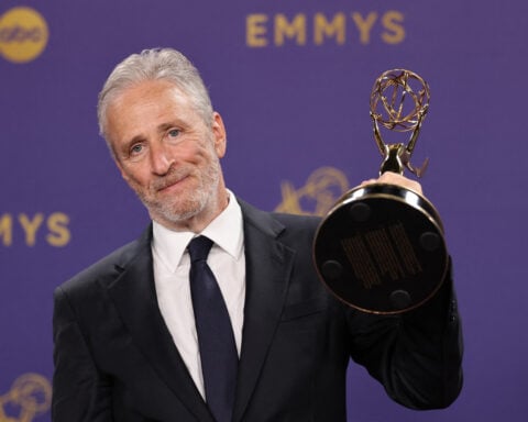 Jon Stewart will remain at the helm of 'The Daily Show' until next December