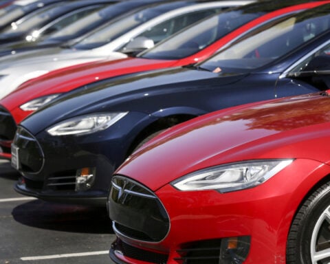 Tesla sued by family who says faulty doors led to wrongful deaths from fiery crash