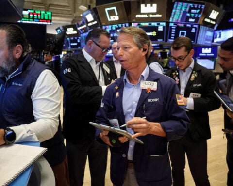 Trading Day: Economic reality damps AI, deals optimism