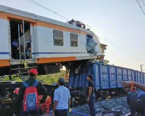 Passenger train collides with cargo train in central India, killing at least 11