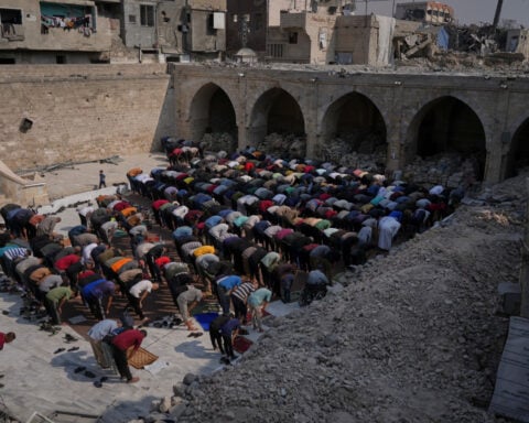 Israel returns bodies of 15 Palestinians after militants return remains of an Israeli hostage