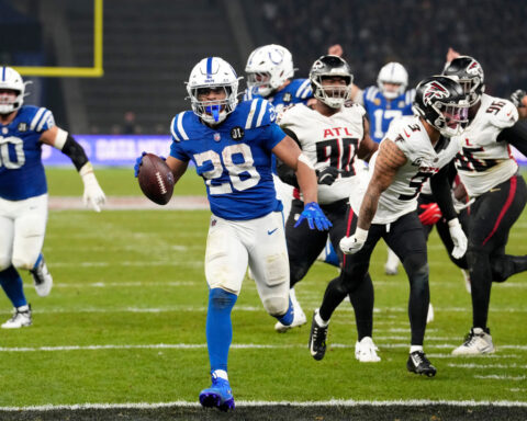 Taylor runs for 244 yards and 3 TDs for Colts in 31-25 OT win over Falcons in Berlin