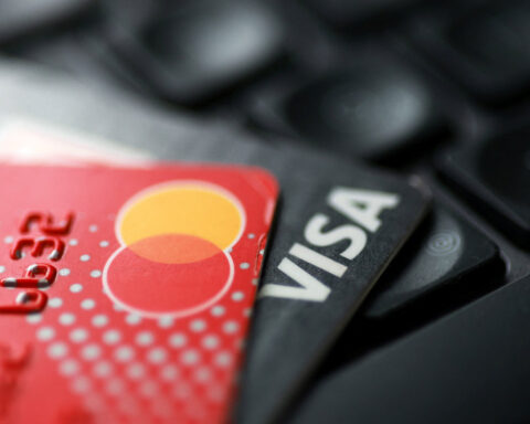 Visa, Mastercard reach revised swipe fee settlement with merchants