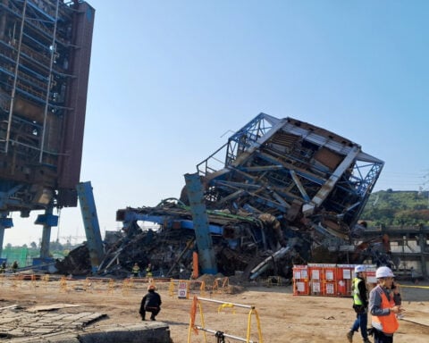 South Korea rescuers use explosives to reach workers trapped at collapsed building