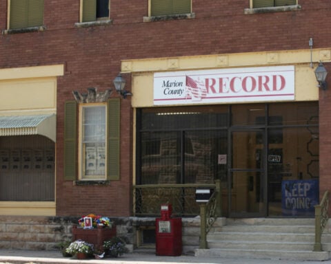 A Kansas county agrees to pay $3 million and apologize over a raid on a small-town newspaper