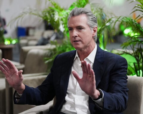 Newsom tells AP the eight senators who struck the shutdown deal aren't alarmed enough about Trump