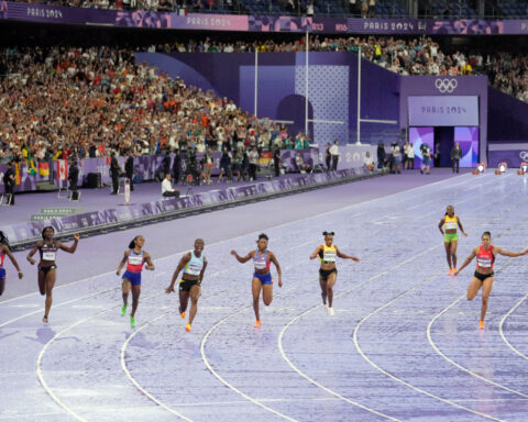 Track to open LA Olympics, with women's 100-meter sprinters lining up three times in the same day