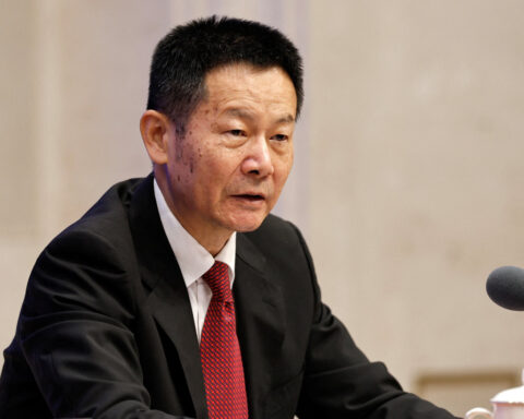 China’s securities regulatory chief seeks approval to step down, sources say