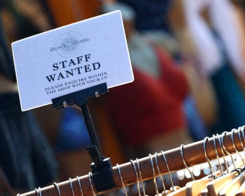 UK's jobs downturn abates slightly ahead of budget, survey shows