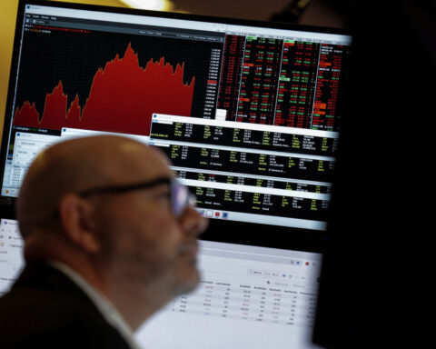 Wall Street ends mixed; traders look to Nvidia report