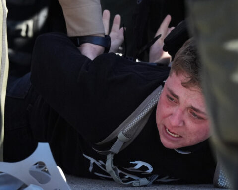 Protesters arrested, officers injured in clash outside Chicago-area immigration facility