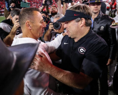 Stockton accounts for 5 touchdowns to outshine Manning as No. 5 Georgia beats No. 10 Texas 35-10