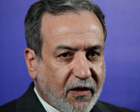 Iran's foreign minister says the nation is no longer enriching uranium at any site in the country