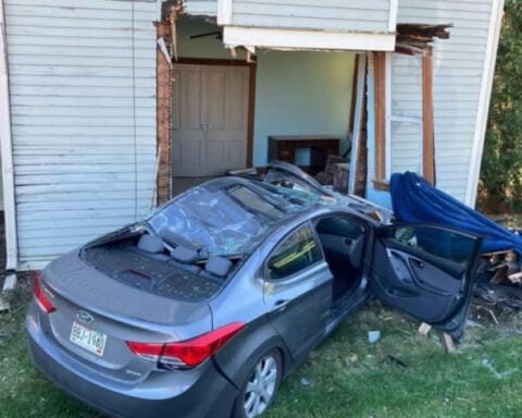 Car carrying 3 people crashes into house in Washington County