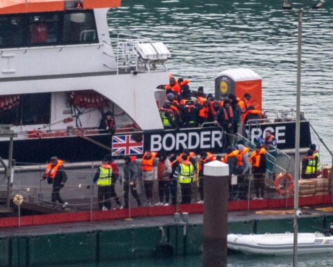 How does Britain plan to overhaul its asylum system?