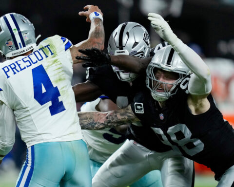 Cowboys honor Kneeland, then get 4 TD passes from Prescott in 33-16 win over Raiders