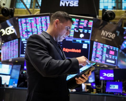 Investors raise risk bets but cash flashes 'sell signal' - BofA survey