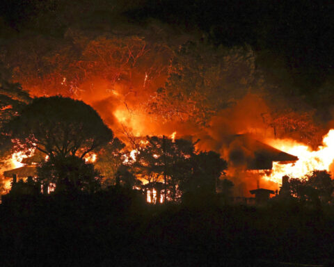 Fire burning in southwestern Japan damages 170 homes and forces evacuations