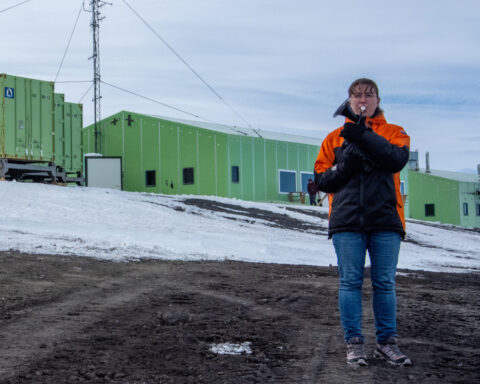 On the world’s coldest stage, a military musician plays with a plastic horn and double gloves