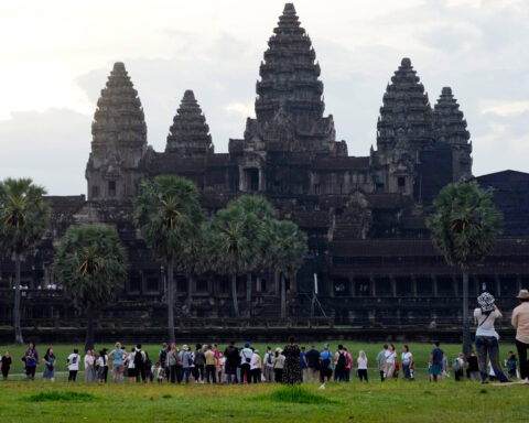 A night bus from Cambodia's top tourist destination plunges off a bridge, killing 16 passengers
