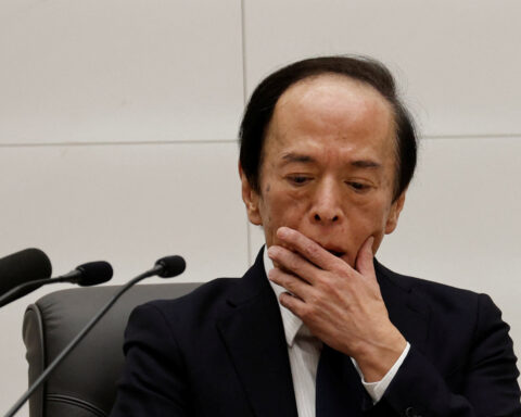 Bank of Japan signals chance of December rate hike as yen slides