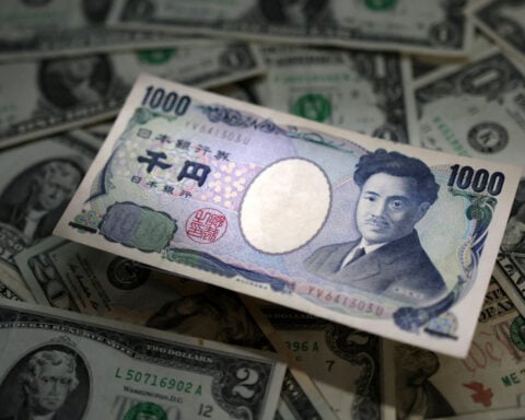 Dollar slips against yen but heads for broad weekly rise