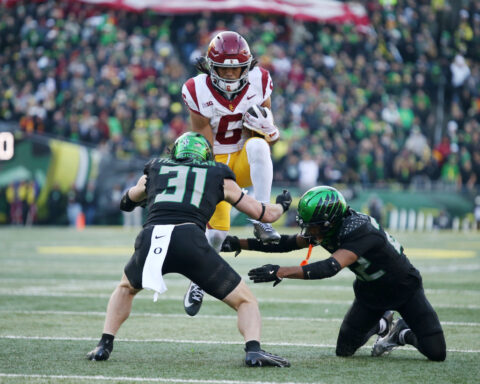 Moore throws 2 TD passes and No. 6 Oregon derails No. 16 USC's CFP hopes with a 42-27 win