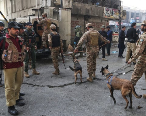 Suicide bombers strike security force headquarters in northwestern Pakistan, killing 3 officers