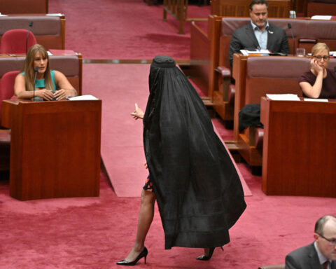 Australian far-right senator wears burqa to parliament, sparking outrage