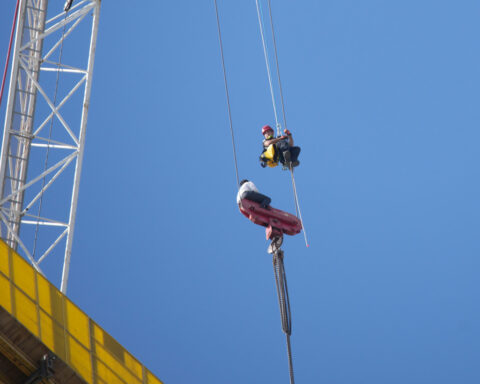 Fire teams rescue 15-year-old stuck on crane over high-rise building in Jerusalem