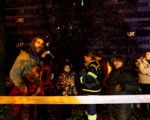 Russian drones trigger fires in Kyiv dwellings, killing one, officials say