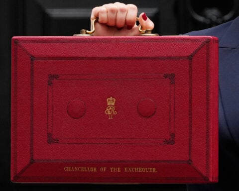 Britain's unpopular government prepares a high-stakes budget and hopes for growth