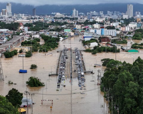Thai military takes charge of flood crisis as heavy rains hobble relief effort