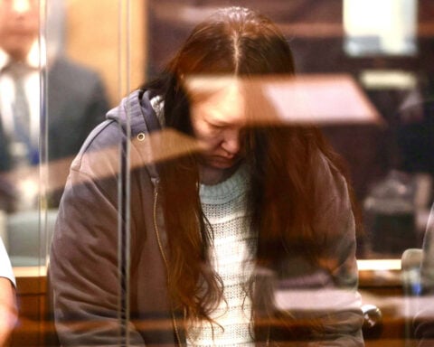 A woman who murdered her 2 children and left them in suitcases is jailed for at least 17 years