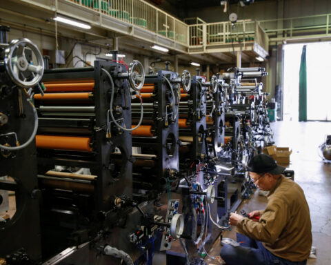 Japan manufacturers' union to target $77 monthly base pay hike next year