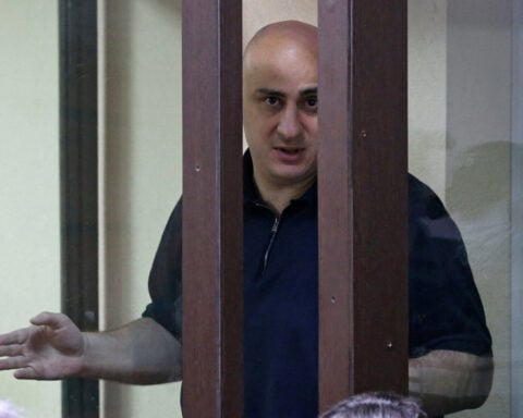 Jailed Georgian opposition politician gets extra sentence for splashing water at judge