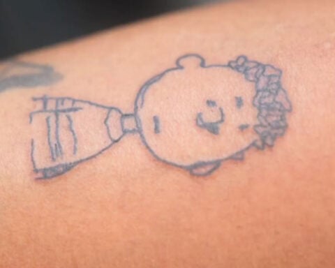 Tattoo artist inks 6-year-old's design on himself after boy wins shop contest