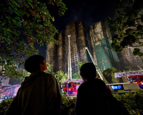 Hong Kong police arrest construction firm bosses over fire; death toll hits 83 with scores missing