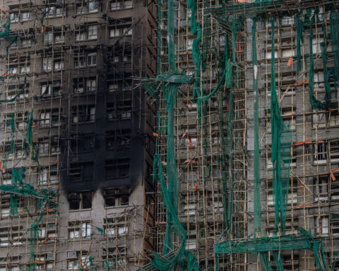 Bamboo scaffolding helped build Hong Kong's skyline, but a deadly fire may hasten its end