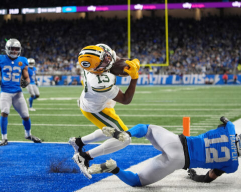 Love matches career high with 4 TD passes, lifting Packers to 31-24 win over Lions