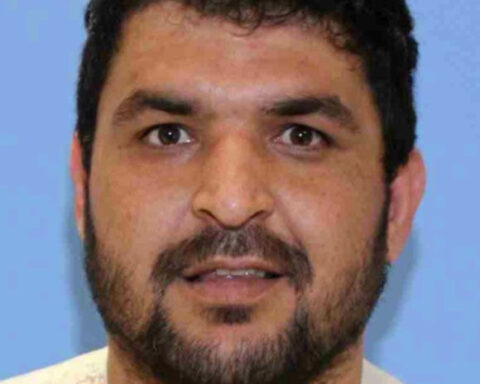 Accused National Guard shooter held without bond after pleading not guilty to murder and assault charges from hospital bed